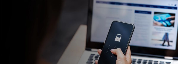 Hand touching a touchscreen with a padlock icon