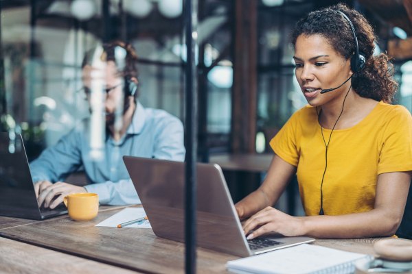 Call center professionals working side by side in the office